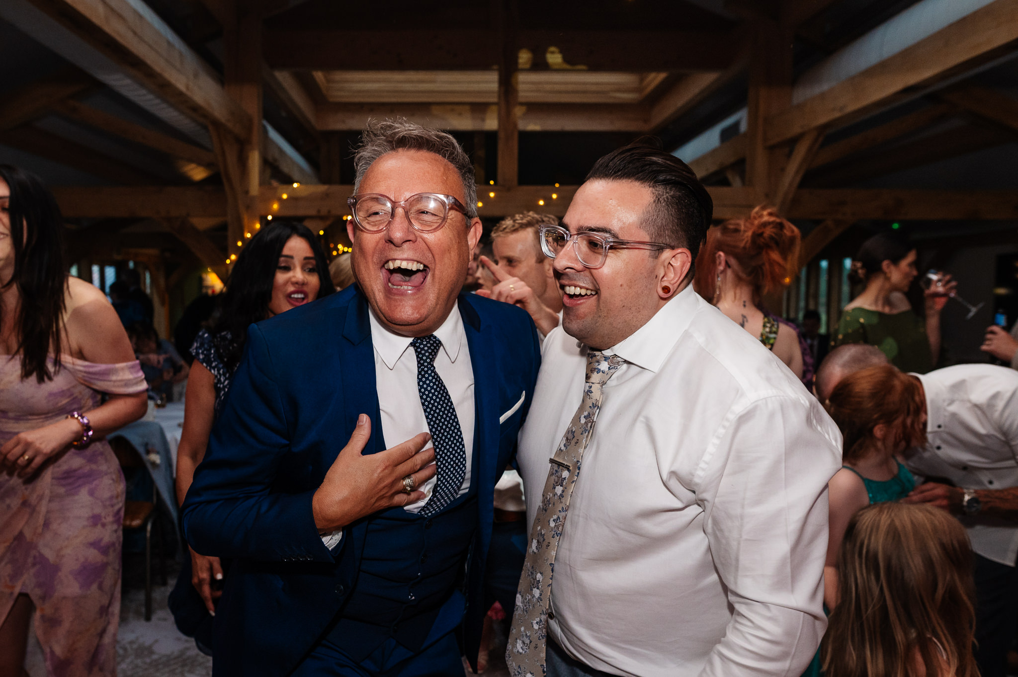 groom with a guest on the dance floor 
