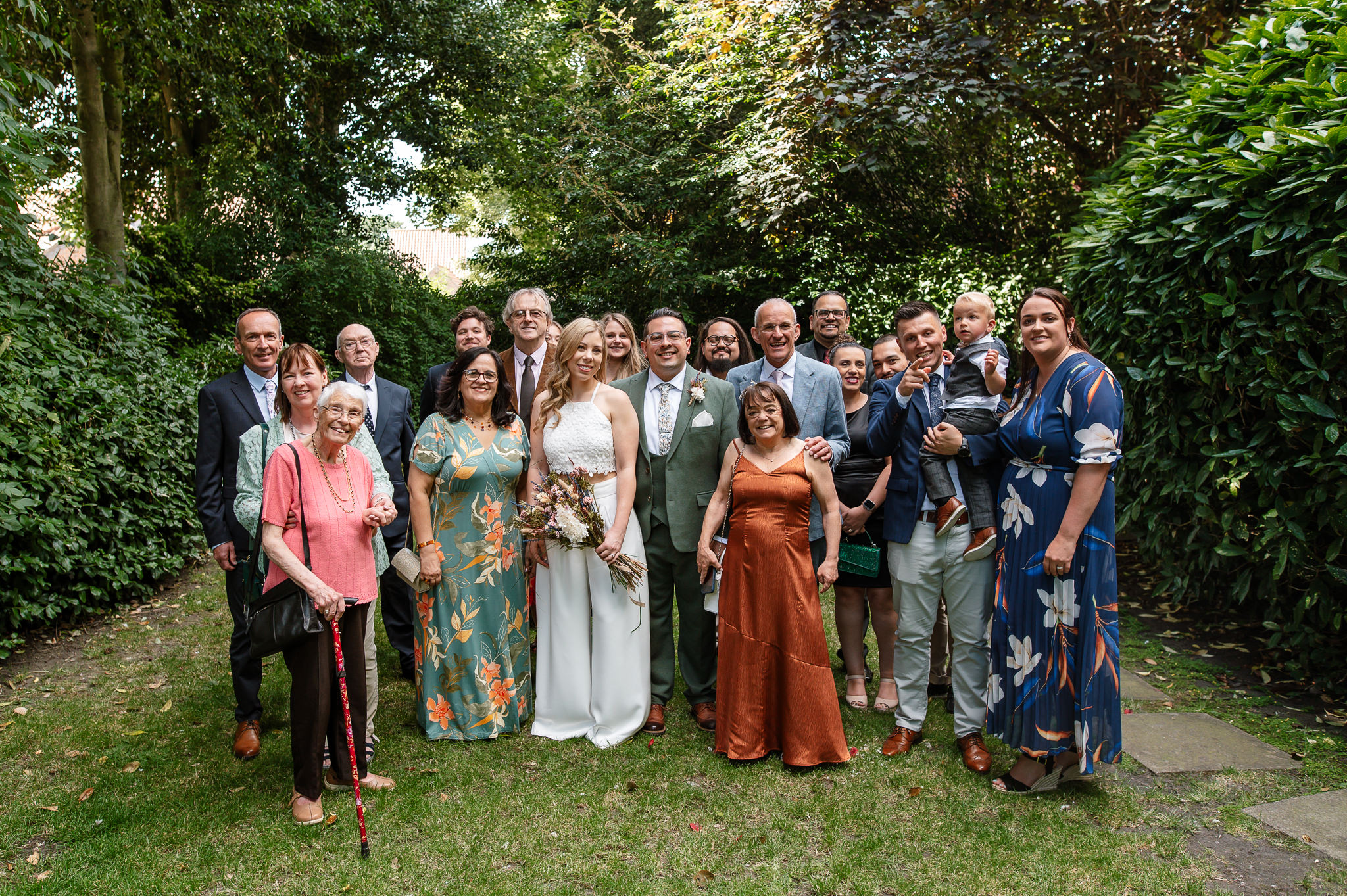 full group shot of wedding party in york registry office gardens 