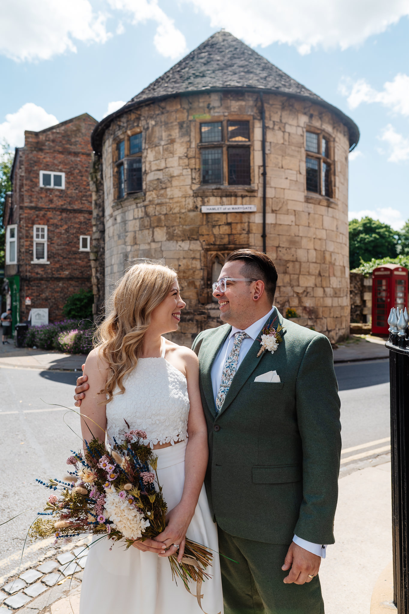 bride and groom looking at each other during couples portraits in york