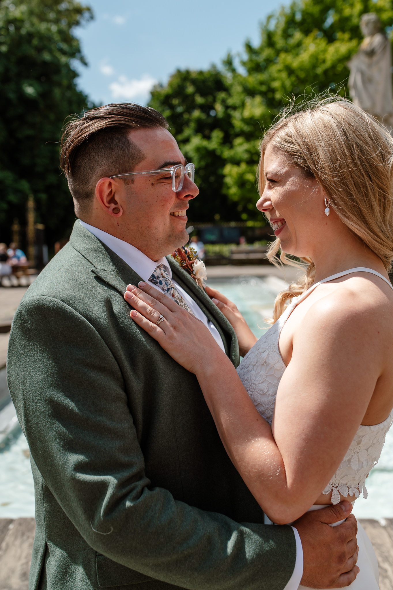 bride and groom smiling looking at eachother