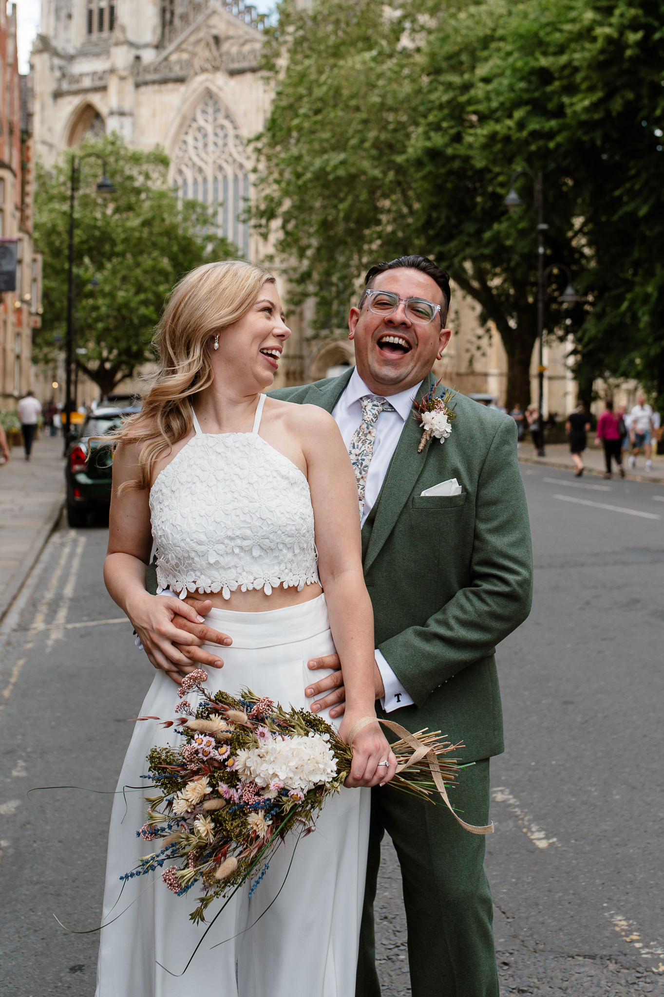 bride and groom laughing 