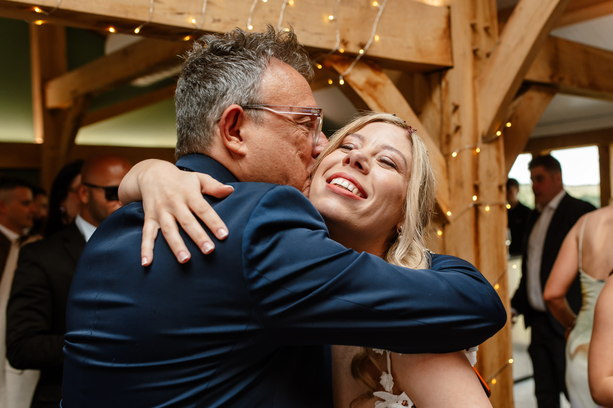 bride hugging guests 