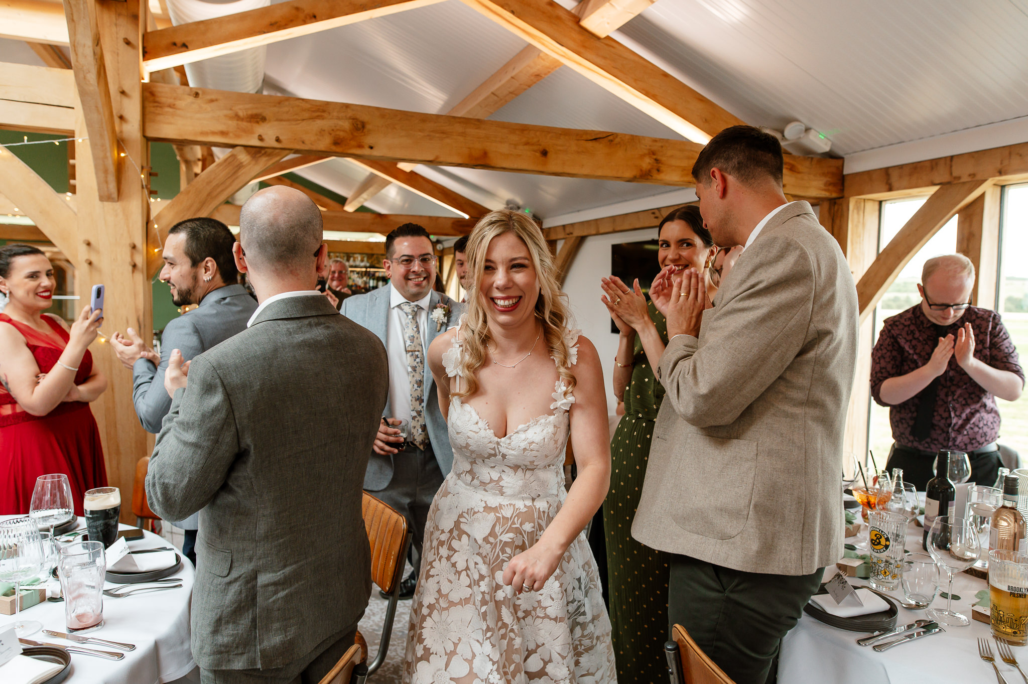 bride and grooms first entrance as husband and wife at wedding reception 
