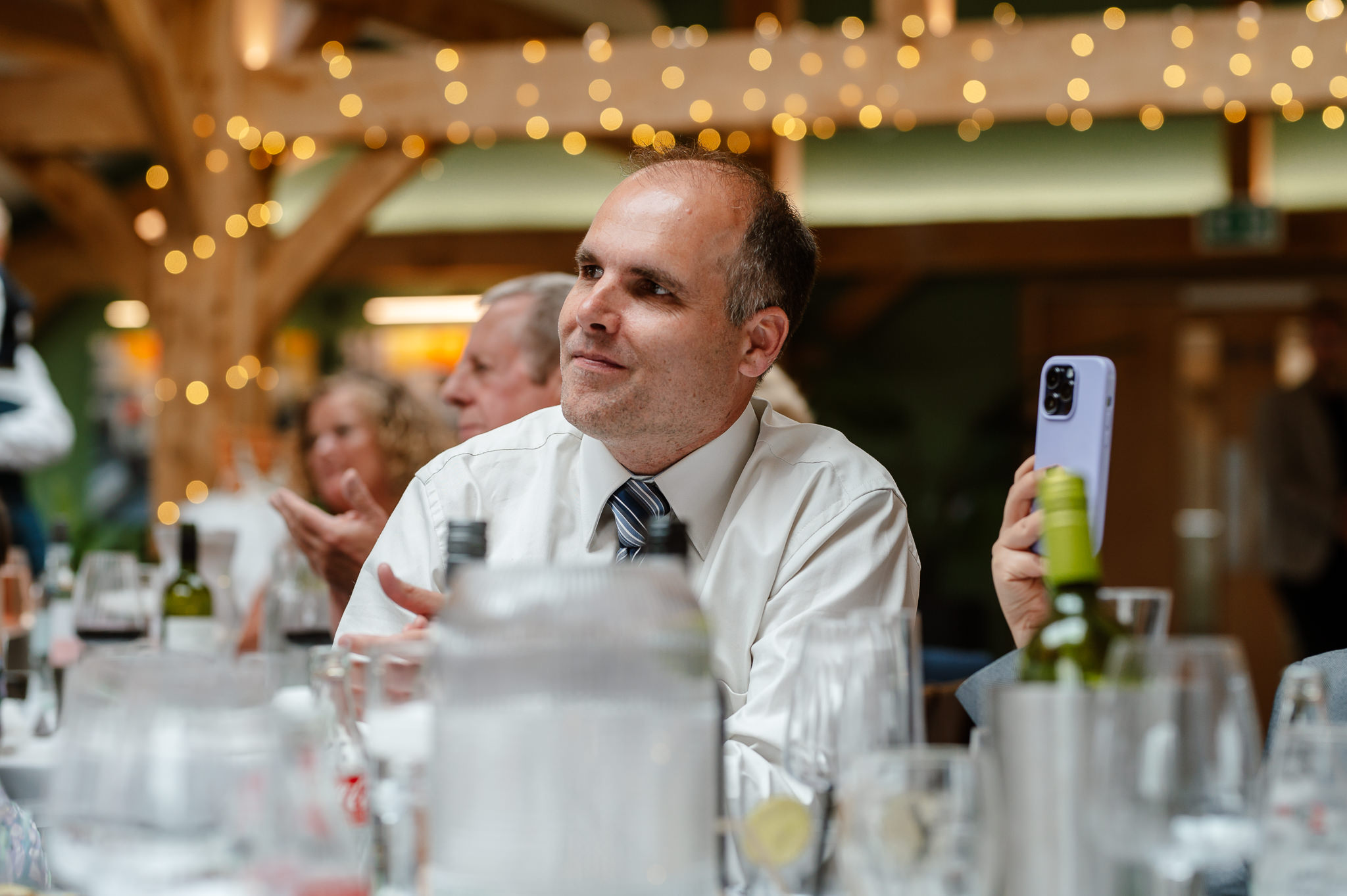 guest candid listening to speeches 