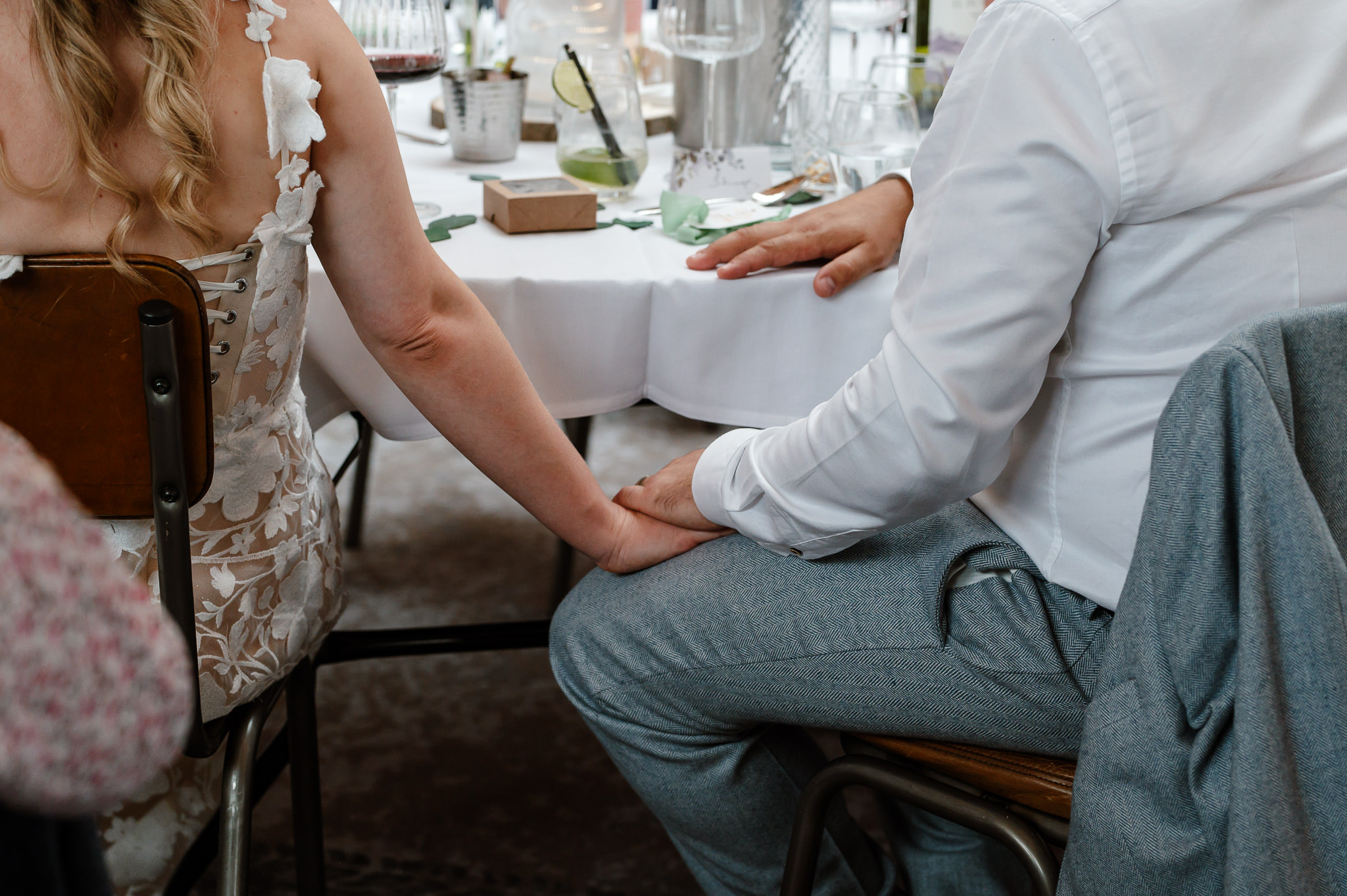 bride and groom holding hands 