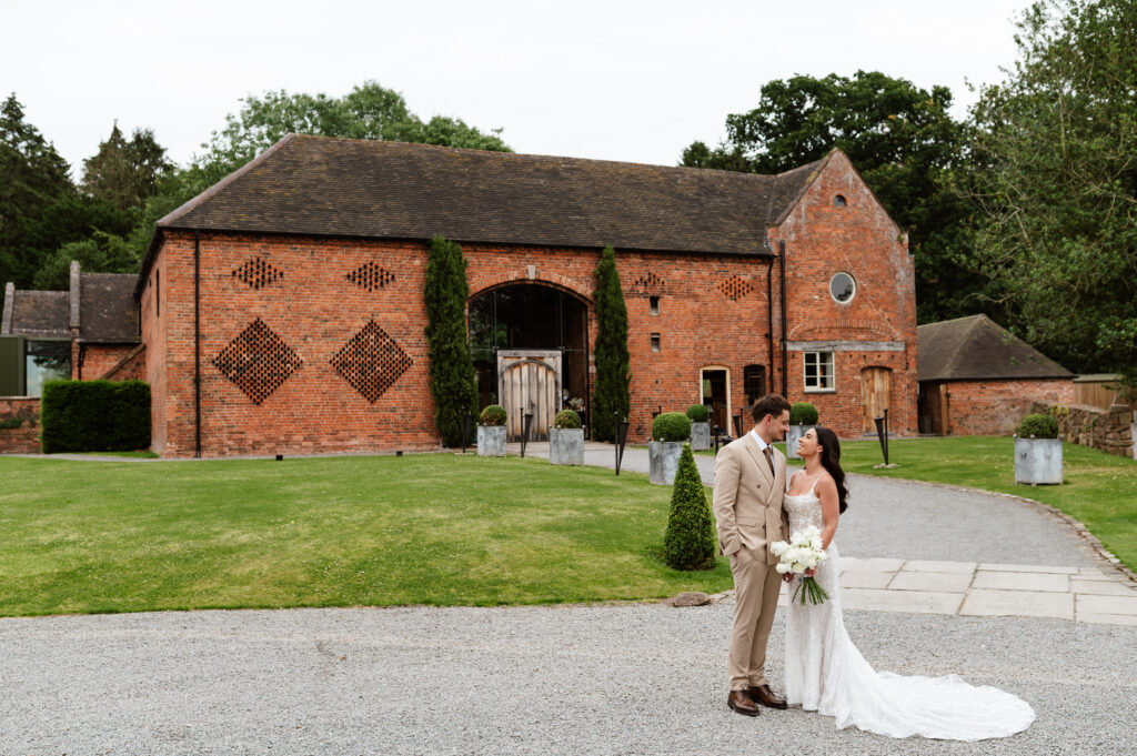 wedding couples portrait session outside of shustoke barn wedding venue