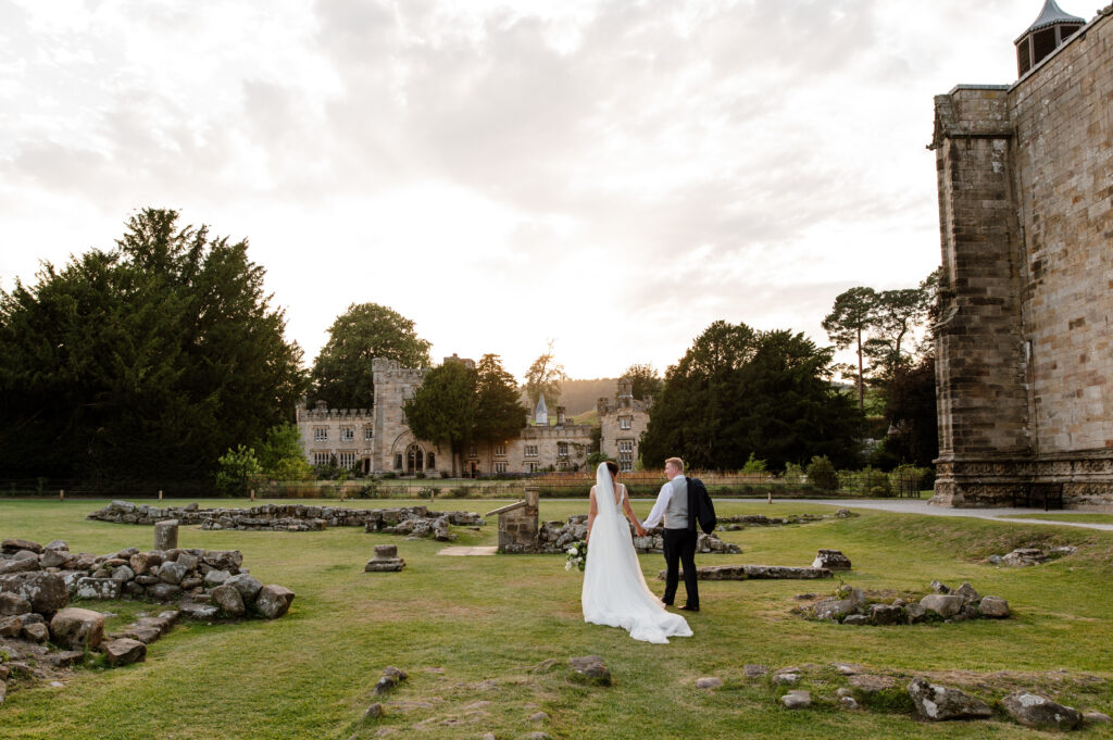 Wedding couples portrait session walking away into the sunset at Bolton Abbey North Yorkshire